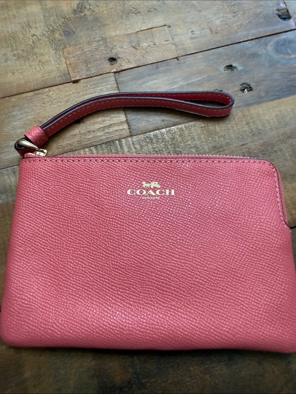 COACH Coral Pink Leather Wristlet with Gold Logo